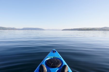 Kayak on peaceful calm water on the Firth of Clyde Scotlandの写真素材