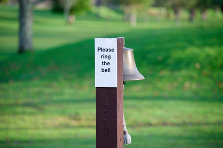 Ring the bell please sign on golf courseの写真素材