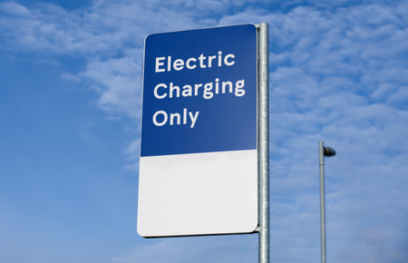 Electric recharging point for vehicle car or bike free no charge in car parking spaceの写真素材