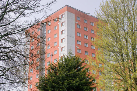 High rise council flats in poor housing estate and empty play area