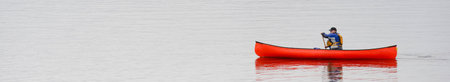 Kayak on peaceful calm water on Loch Lomondの写真素材