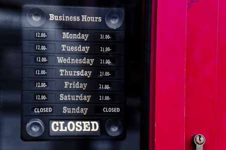 Business shop opening and closed times in hours and daysの写真素材