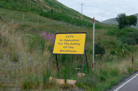 Road workers safety sign at roadworks in rural areaの写真素材