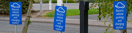 Electric recharging point for vehicle car or bike free no charge in car parking spaceの写真素材