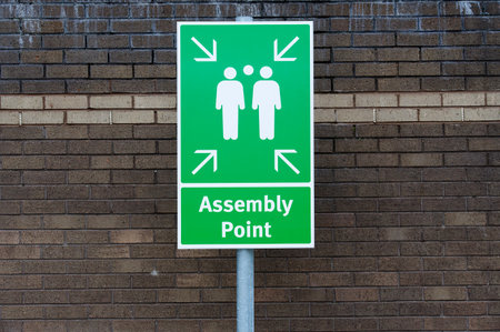 Fire assembly point sign at workplace signpostの写真素材