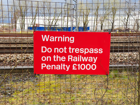 Trespass warning sign and penalty notice at railwayの写真素材