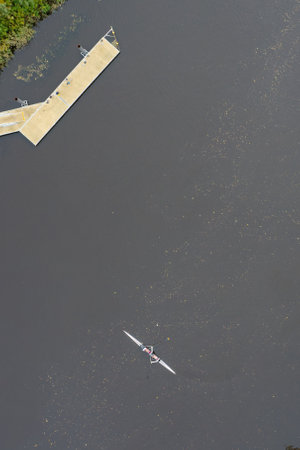 Man training on canoe in isolation on the River Clyde