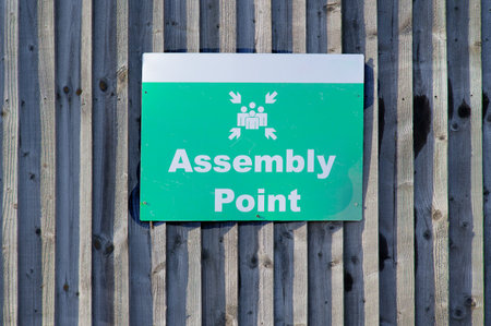 Fire assembly point sign at workplace signpostの写真素材