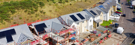 Solar panels installed on home roofs at new housing development