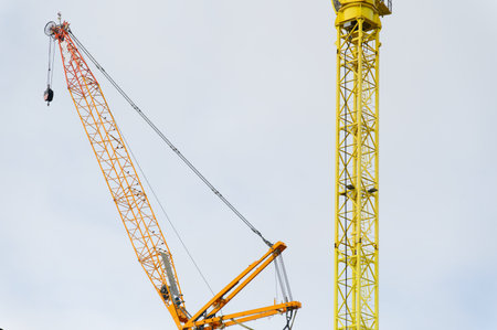 Tower crane high in sky at construction site