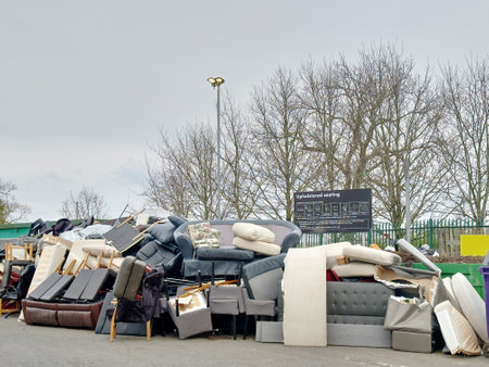 Upholstered sofas and chairs at refuge dump for recyclingの写真素材