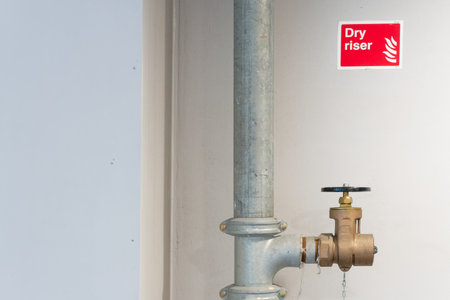 Dry riser landing valve within office building