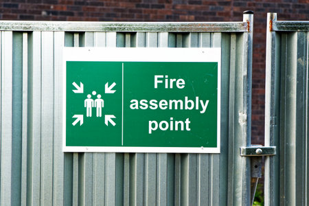 Fire assembly point sign at workplace signpostの写真素材