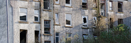 Tenement flats in poor housing area in Port Glasgowの写真素材