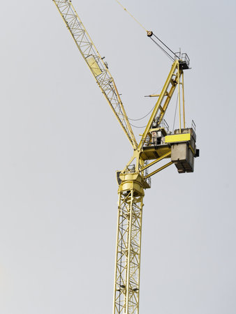Tower cranes high in sky at construction site