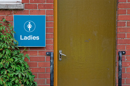 Toilet sign at public facility outdoors in parkの写真素材