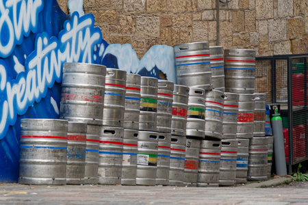 Glasgow, UK, March 29th 2025, Beer and alcohol barrel kegs in a stack outside pub