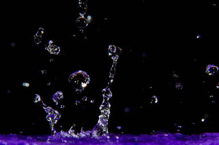 Purple Water Splashの写真素材