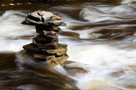 Flat Rocks Stacked in a Riverの写真素材