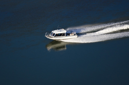 Pleasure Boat Moving Down River