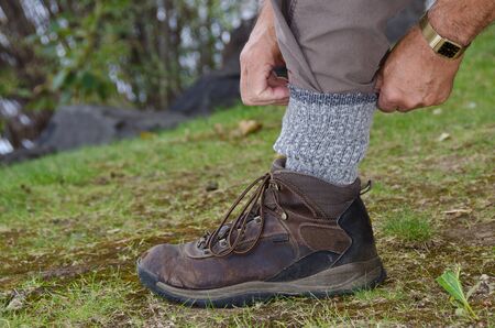 Protecting Against Ticks by Tucking Pants into Socksの写真素材
