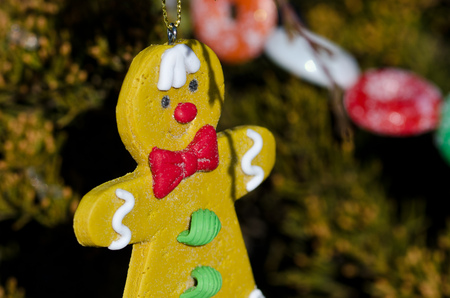 Gingerbread Man Decoration on an Outdoor Christmas Tree