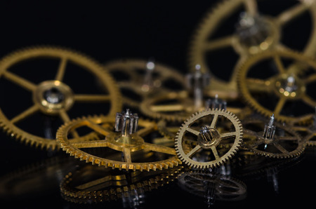Watch Parts: Collection of Vintage Metallic Watch Gears on a Black Surface