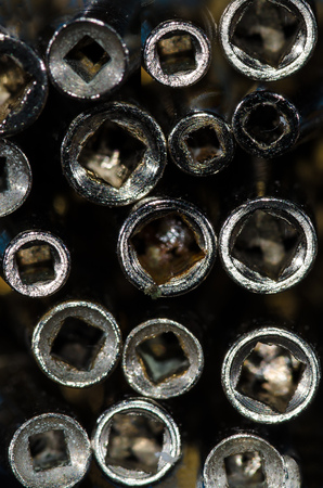 Abstract: View Into the Barrel of a Set of Antique Pocket Watch Keysの写真素材