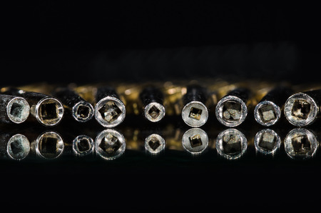 View Into the Barrel of a Row of Antique Pocket Watch Keysの写真素材