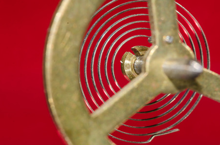 Abstract: Looking Through a Vintage Metallic Balance Wheel to Its Hairspringの写真素材