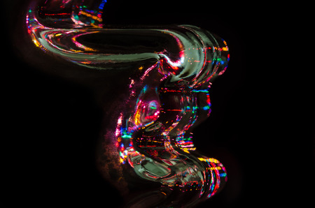Abstract: Flow of Colored Light Reflecting in the Blackness