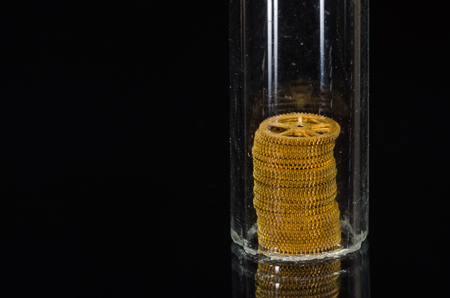 Watch Repair: Close Look at a Tower of Watch Gears Under Glass Vialの写真素材