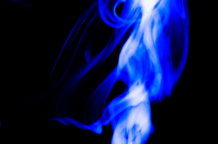 Nature Abstract: The Delicate Beauty and Elegance of a Wisp of Blue Smokeの写真素材