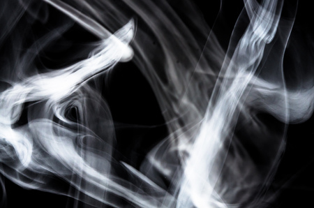 Nature Abstract: The Delicate Beauty and Elegance of a Wisp of White Smokeの写真素材