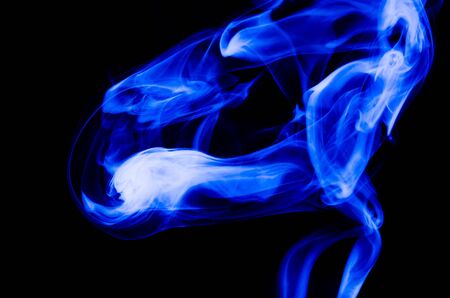 Nature Abstract: The Delicate Beauty and Elegance of a Wisp of Blue Smokeの写真素材