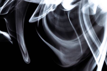 Nature Abstract: The Delicate Beauty and Elegance of a Wisp of White Smokeの写真素材