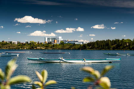 Calgary Alberta Canada, September 30 2021: The Rockyview General Hospital with kayaks and canoes anchored at the Calgary Canoe Club on Glenmore Reservoir.のeditorial素材