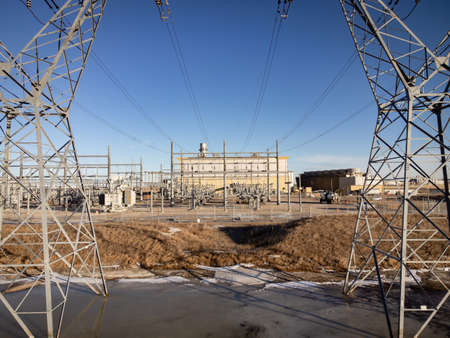 Transmission towers and a natural gas power generation plant in Alberta Canada.
