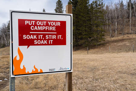 Kananaskis Alberta Canada, April 04 2022: A campfire awareness sign along the Sibbald Flats Trail in a provincial park.のeditorial素材
