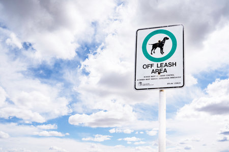 Calgary Alberta Canada, June 08 2022: An off leash dog park sign posted in a public location with municipal bylaw information.のeditorial素材