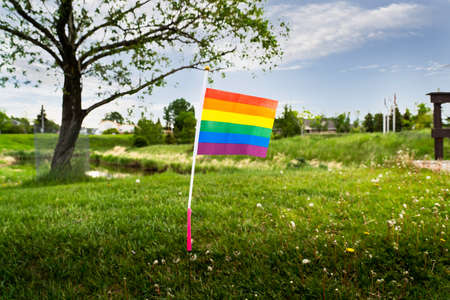 Airdrie Alberta Canada, June 12 2022: Home made miniature rainbow flag at a public park recognizing...