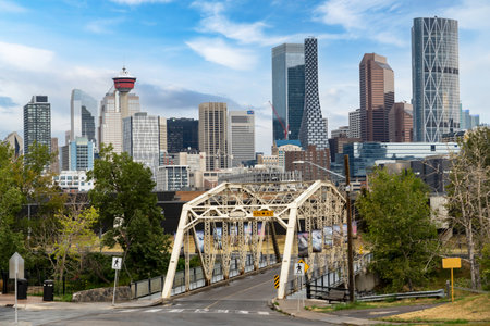 Calgary Alberta Canada, September 01 2022: Calgary skyline with an old truss bridge near the East Village and popular landmarks at background.のeditorial素材