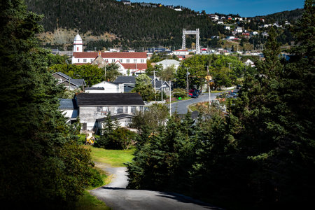 Landmarks and tourist attractions standing tall in the town of Placentia Newfoundland with a historic church and distant Sir Ambrose lift bridge in the East Coast of Canada.の写真素材