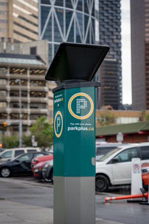 Calgary Alberta Canada, November 09 2023: Park Plus parking meter for registering your parked car powered by a solar panel in the downtown core.のeditorial素材