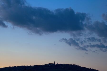 Late evening clouds above Pienza Italyの写真素材