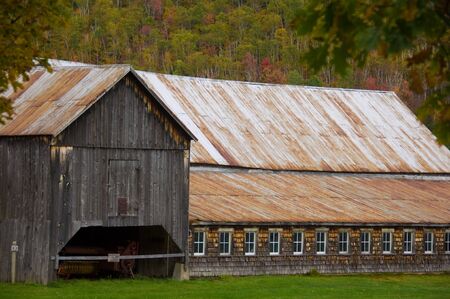 Old barn with a rusted metal roofの写真素材