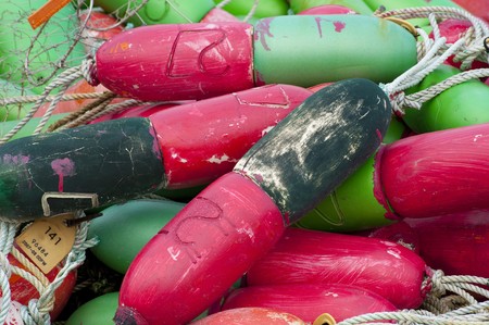 Colorful red and green buoys used for trapping crabsの写真素材