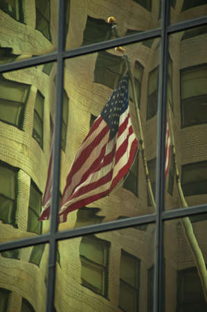 Urban buildings reflected in the glass windows of skyscrapers.の写真素材