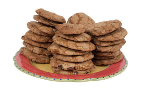 Stack on chocolate chip cookies on a red plate