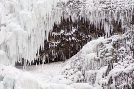 Icicles in winter, hanging from a cliffの写真素材